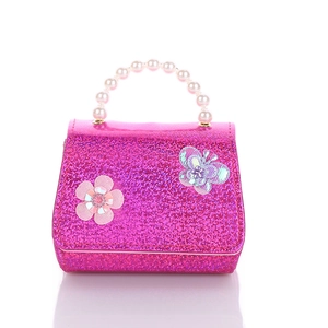 Pink glitter girls' handbag with pearl handle, floral and butterfly decorative accents