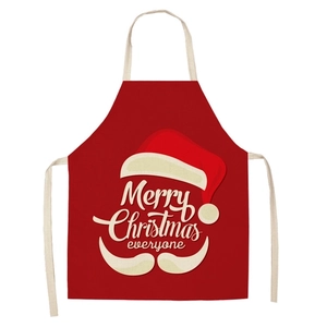 Detail of red linen Christmas apron featuring a Santa beard design and Merry Christmas text