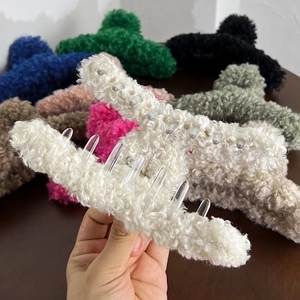 Plush faux fur shark hair claw clips in various colors for elegant French style hair styling
