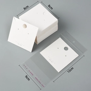 Detail of white 8x8cm jewelry display cards with matching 9x12cm clear self-seal bags