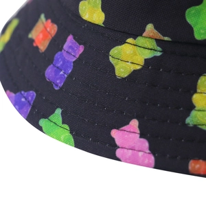 Detail of colorful gummy bear print on black canvas sun hat with precision stitching