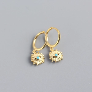 Close-up of gold S925 sterling silver evil eye hoop earrings with turquoise stones