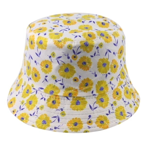 Close-up of small yellow daisy patterns and purple leaf prints on white bucket hat