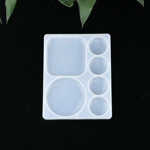 Detailed macro view of a 6-compartment translucent silicone mold for DIY resin crafts