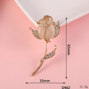 Detailed view of golden rose brooch with opal stone and rhinestones, size 65mm x 33mm