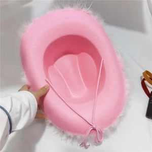 Pink western cowboy hat with white faux feather trim and adjustable chin strap