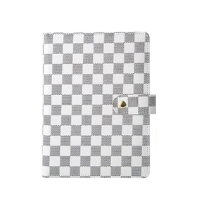 A5 faux leather notebook featuring a white and grey checkered pattern and gold snap button