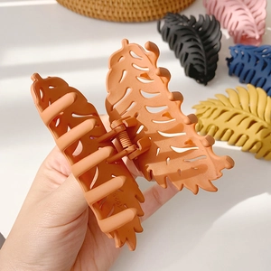 Matte leaf hair claws in multiple colors including orange black pink blue and yellow