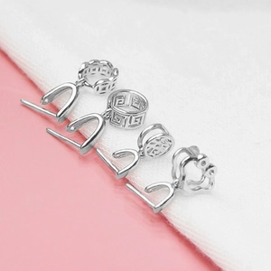 Detailed close-up of four S925 sterling silver pinch bails for DIY crystal pendants