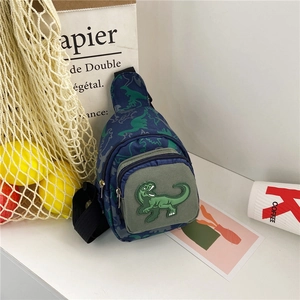 Detail of blue dinosaur kids chest bag with green embroidery and dual zipper closure