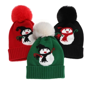 Kids knitted Christmas beanie with snowman pattern and pom pom in red, green, and black
