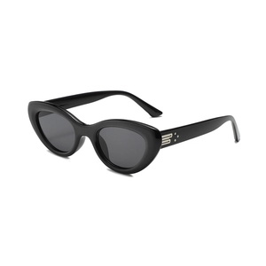 Classic black cat-eye sunglasses with luxury metal logo accent and UV protective lenses