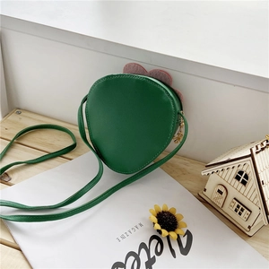 Detail of cute strawberry shape girl crossbody bag with metal flower zipper puller
