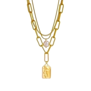 Golden multi-layer titanium steel chain necklace featuring a pearl and face portrait pendant