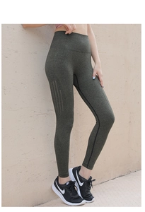 Detail of high-waisted seamless yoga leggings with laser-cut ventilation and gray texture