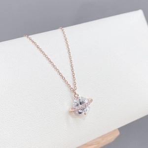 Rose gold Saturn planet pendant necklace with sparkling cubic zirconia pavé stones