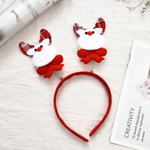 Christmas reindeer antler headband with red plush fabric and festive spring-mounted dolls