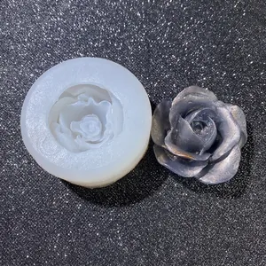 Rose flower silicone mold with finished metallic silver resin craft on dark background