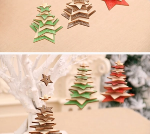Detailed view of tree-shaped wooden Christmas ornaments in green, brown and red tones