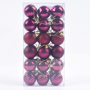 Detail of 36pcs magenta Christmas balls with glitter, matte and spiral textures in box