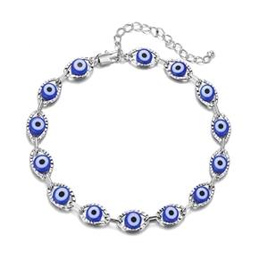 Detail of silver Evil Eye link bracelet featuring blue resin beads and lobster clasp