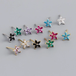 Detailed view of flower-shaped mini stud earrings with multi-colored cubic zirconia gems