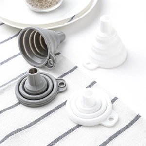 Set of collapsible silicone kitchen funnels in grey and white colors, expanded and folded