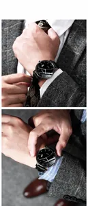Detail view of men's business watch with black leather strap and silver steel casing