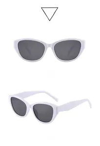 Détails macro de lunettes de soleil œil de chat blanches avec verres gris et monture