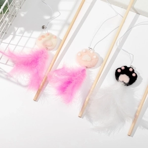Three wooden cat wands with pink and white feathers and cute felt paw attachments