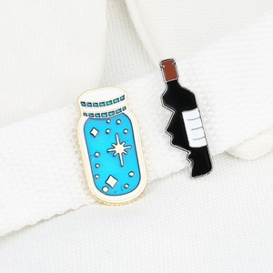 Cute enamel fishbowl and wine bottle brooch pins with gold and silver outlines