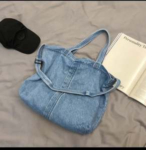 Vintage blue denim tote bag for women with wide shoulder straps and stitched details