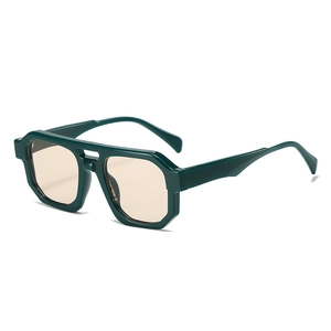 Modern irregular polygon sunglasses with dark green frames and amber tinted lenses