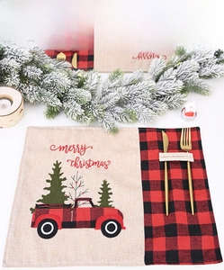 Linen Christmas placemat with red truck pattern and pocket for golden cutlery