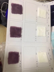 Close-up of lamb fleece fabric swatches in purple and cream white for rabbit hooded blanket