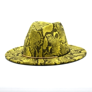 Detail of bright yellow wool fedora with black snake print and gold metal band accent