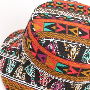 Close-up of geometric tribal print fabric detail on a reversible sun bucket hat