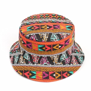 Detail of colorful geometric patterns and ethnic floral print on fisherman sun hat