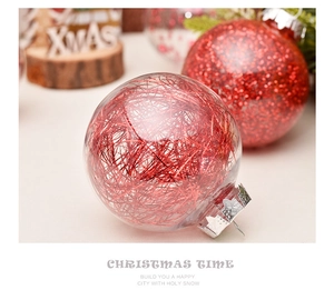 Detail of 6cm transparent Christmas ball filled with red tinsel and silver cap