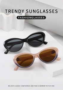 Close-up of trendy cat eye sunglasses in black and gradient pink on white podiums