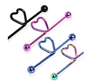 Close-up of heart-shaped industrial barbell earrings in diverse metallic finishes