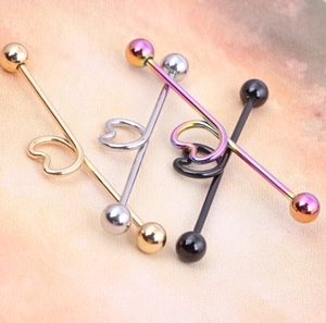 Set of four industrial barbell piercings with heart center in gold, silver, black, and rainbow