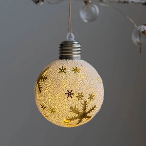 LED Christmas light ball with white snow texture and golden snowflake patterns