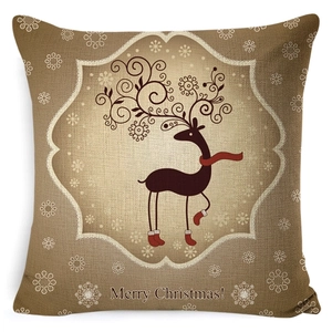 Detail of linen texture and reindeer pattern with Merry Christmas text on pillowcase