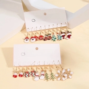 Set of 5 pairs of festive Christmas enamel earrings featuring reindeer and snowflakes