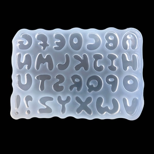 Overhead view of a translucent silicone mold with letters and numbers for DIY crafts