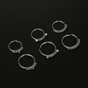 Set of 6 silver 20G surgical steel nose rings featuring small metal beads and clear zircon gems