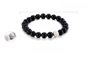 Detail view of 8mm matte black agate and turquoise beaded bracelet with size dimensions
