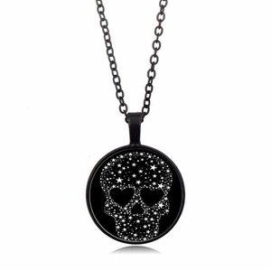 Vintage black skull necklace with star patterns and heart eyes on a crystal pendant