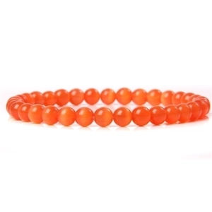 Detailed close-up of 6mm polished orange agate beads on an elastic bracelet